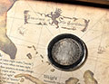 button to a close-up of the pieces of eight limited edition packaging